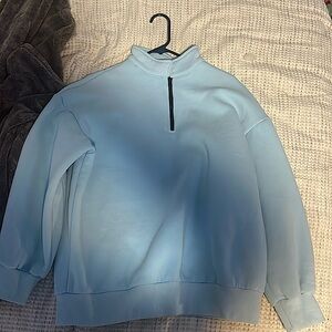 Selling a blue quarter zip jacket
